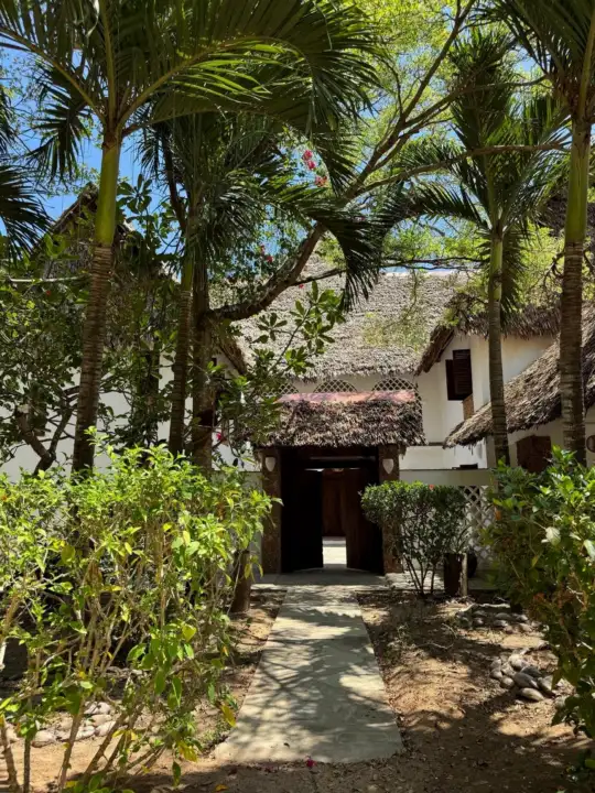 Shaded entrance path to the villa through the tropical garden