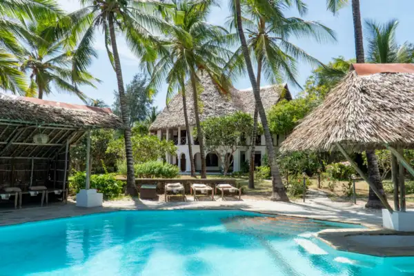 Private pool in front of the two-storey makuti-roofed villa